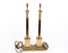 Pair of modern gilt metal corthinium column table lamps. Raised on square stepped bases.