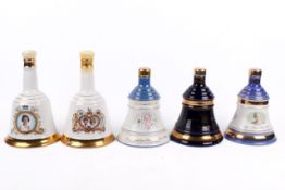 A group of five assorted Royal Commemorative Bell's Scotch whisky decanters, all boxed.