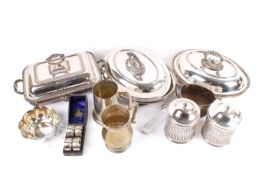 A box of assorted silver plated table items.