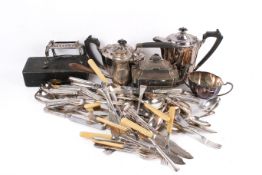 Large collection of assorted silver plate. Mostly flatware, including a tea and coffee pots, etc.