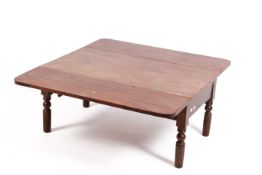 A mahongany Sutherland drop leaf coffee table.