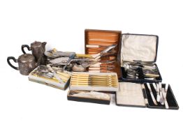 A box of assorted silver plated items, mostly flatware. Including a silver handled shoe horn, etc.