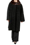 A vintage women's black 'Astra-Furs' coat with brown collar.