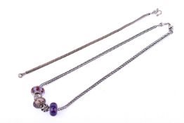 A white metal necklace and bracelet with glass 'Trollbeads' glass beads.