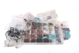 A group of assorted costume jewellery with a large quantity of loose stone and other beads for