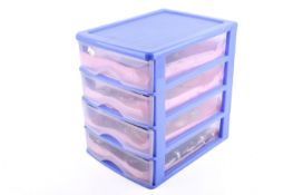 A set of plastic trays of costume jewellery.