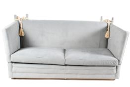 A Mid-20th century duck egg blue Knoll sofa with drop down sides. Sat on castors.