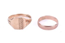A 9ct gold wedding band and a signet ring.