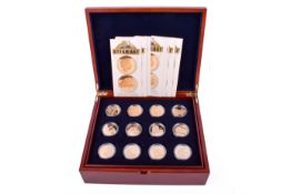 A Royal Mint cased set of eighteen Golden Steam Age collector's silver £5 coins.