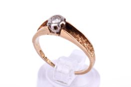 An 18ct gold and diamond solitaire ring. Set with one round brilliant cut diamond of circa 0.
