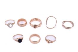 Eight 9ct gold rings of various designs.