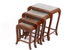 Chinese nest of four carved occasional tables.