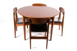 A retro G Plan style teak dining table and four chair with black imitation leather seats.