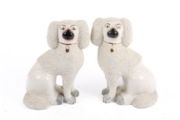 A pair of modern Staffordshire style 'Confetti Poodles'.