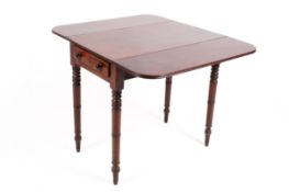 A Victorian mahogany Pembroke table with drop leaf sides.