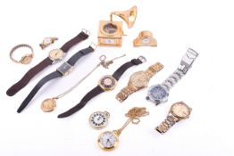 A small group of wristwatches and table timepieces.