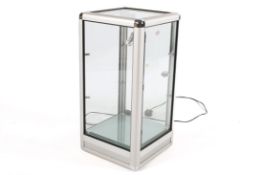 A modern shop fitting, glass display case with lighting to the interior. Along with case.