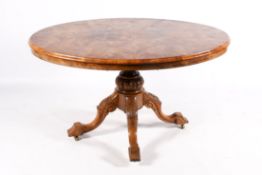 A Victorian walnut pedestal table.