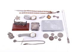A collection of silver and white metal items.