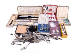 A group of assorted flat and loose silver plated and stainless steel cutlery.