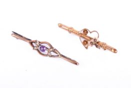 Two gold and yellow metal bar brooches.