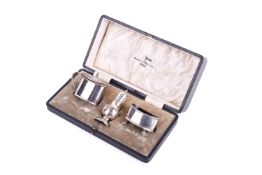 A boxed Walker & Hall silver cruet set.