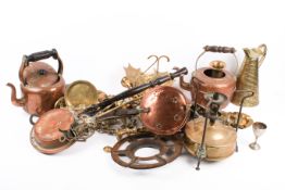 A collection of assorted vintage brass and copperware. Including kettles and a stove, etc.