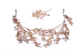 A silver plated tiara and matching pin.