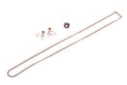 A gold curb link chain and three earrings.