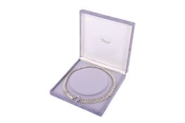 A white metal panel necklace.