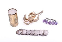 A small group of white and yellow metal jewellery and collectables.