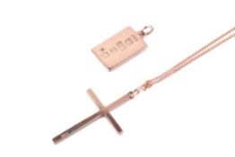 A 9ct gold cross and attendant chain and an ingot pendant.