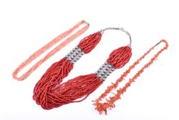 Three coral necklaces with base metal fittings.