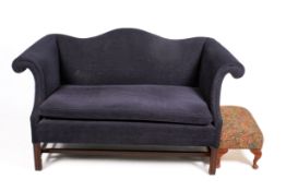A upholstered foot stool with cabriole supports.