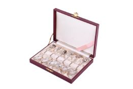 A boxed set of six Chinese white metal spoons.