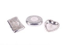 A silver snuff box, cigarette case and a heart shaped dish.