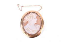 A yellow metal mounted shell cameo brooch.