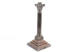 A silver plated corinthium column table lamp base. Raised on a stepped square plinth.