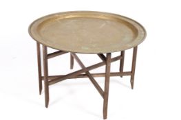 A large 20th century Persian brass circular tray top table.