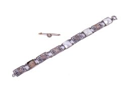 An early 20th century Murrle Bennett Arts & Crafts bracelet and a brooch.