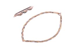 A 9ct gold bar brooch and a plaited tri-colour bracelet.