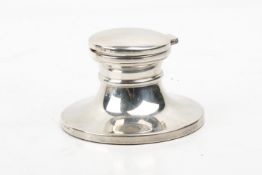 A capistan form weighted silver ink well.