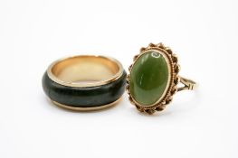 Two 9ct gold and green jade rings.