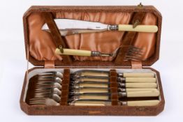 A vintage boxed set of silverplated fish servers.