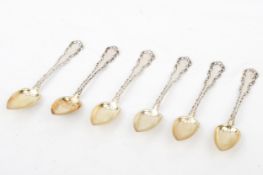 A set of six American silver grapefruit spoons.