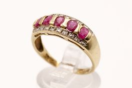 A 9ct gold and ruby ring. Set with five oval faceted rubies of 0.