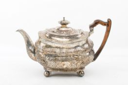A George III silver teapot.
