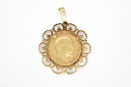 A mounted 1908 half sovereign coin.