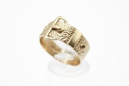 A 9ct gold buckle ring. With detailed textured finish to one half, hallmarked, size V, weight 4.8g.