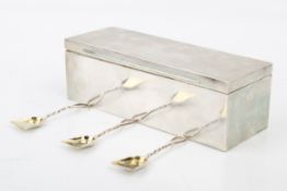 An early 20th century silver condiments or snuff box and three Victorian spoons.
